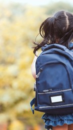 girl with blue backpack walking to school in Copperhaven Spruce Grove